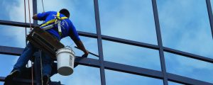 Guy Cleaning High Windows